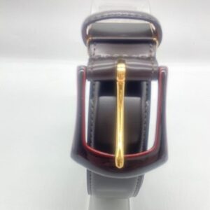 brown cordovan belt with lacquered buckle